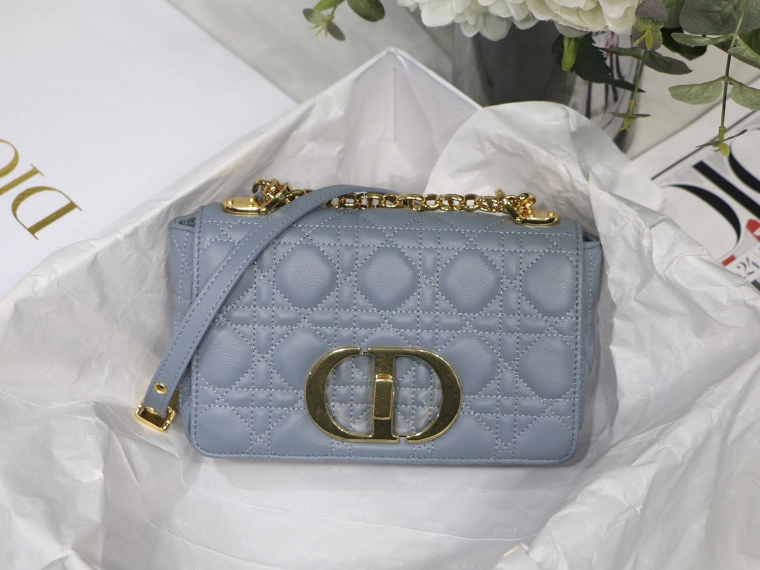 new Edision arrival. The Dior Caro bag is crafted in apricot calfskin and embellished with the signature cannage stitching.