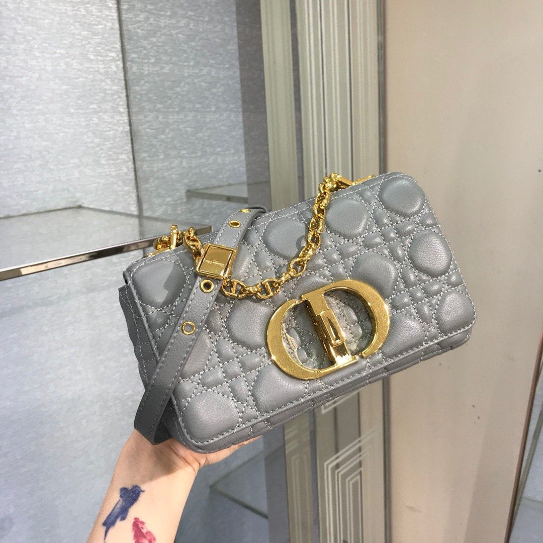 new Edision arrival. The Dior Caro bag is crafted in apricot calfskin and embellished with the signature cannage stitching.