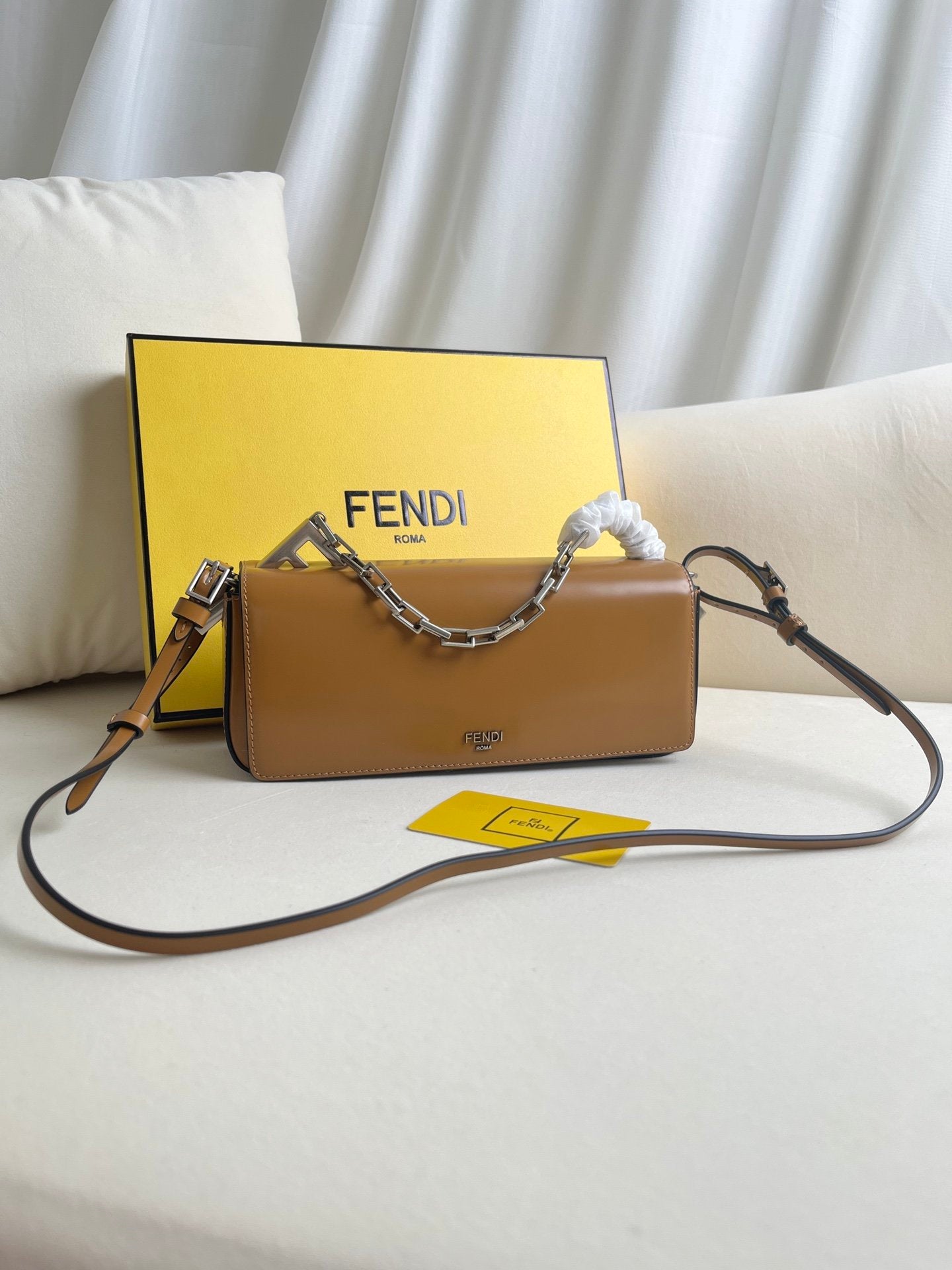 First Sight clutch in smooth calfskin with large F metal hardware and chain