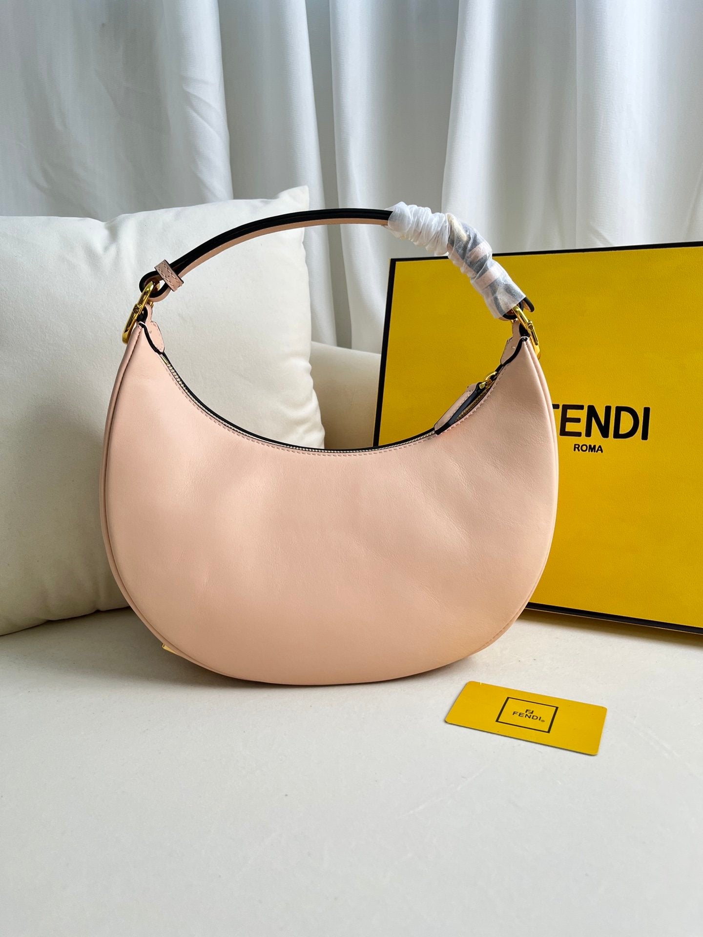 FEND1praphy underarm bag featuring a crescent shape