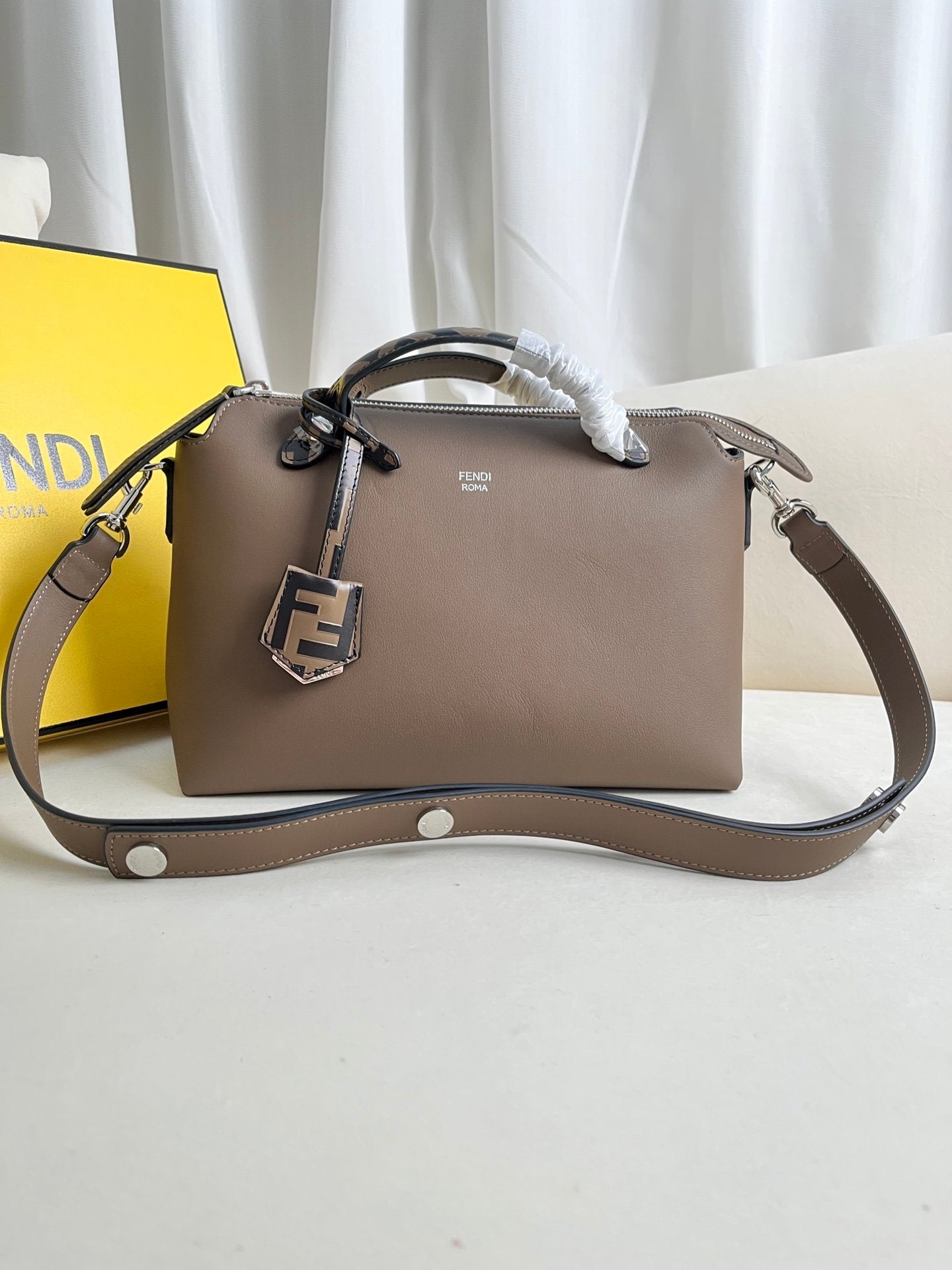 BY THE WAY zipped Boston tote bag with double handles and embellished with a plaque.