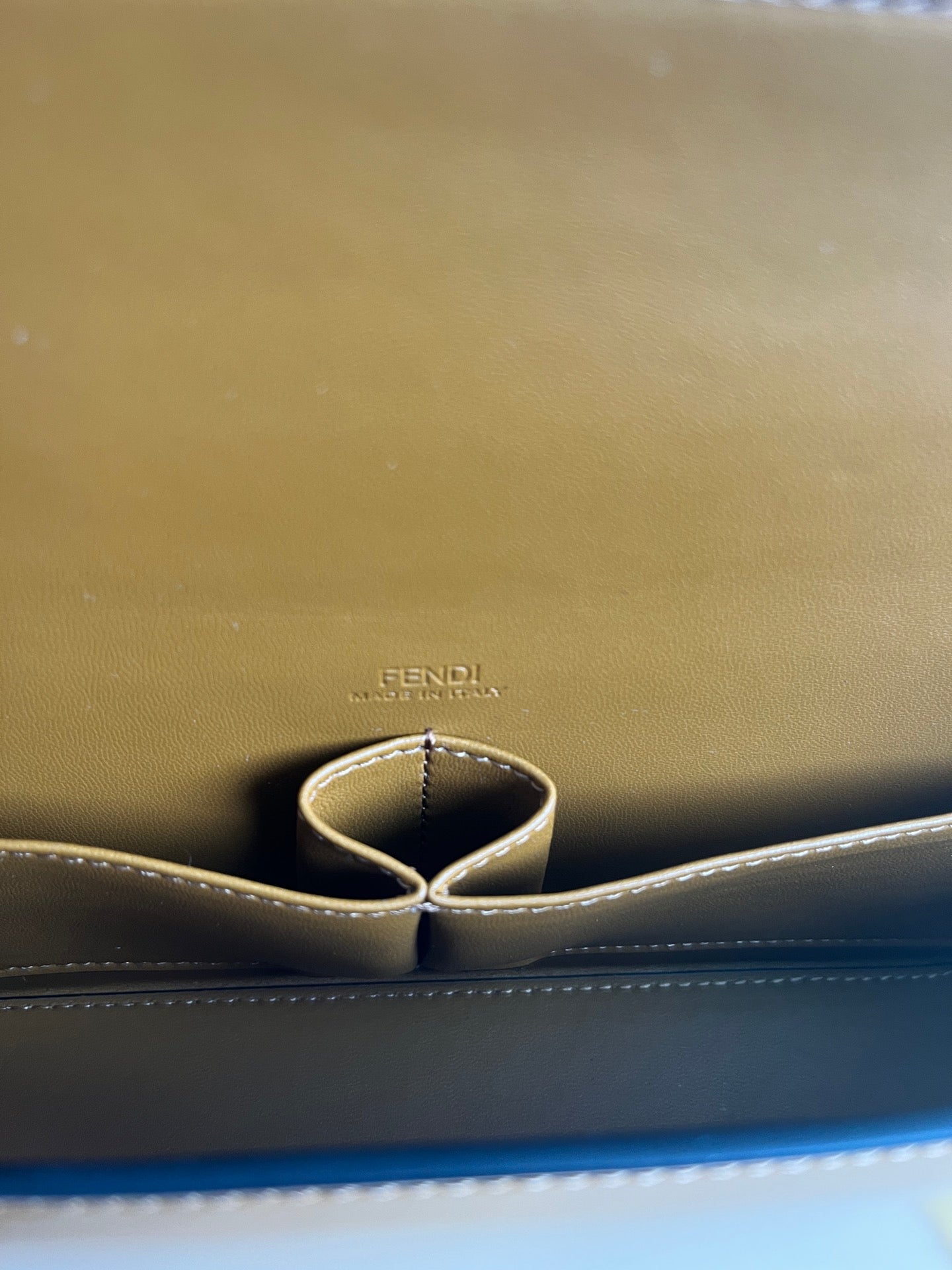 First Sight clutch in smooth calfskin with large F metal hardware and chain