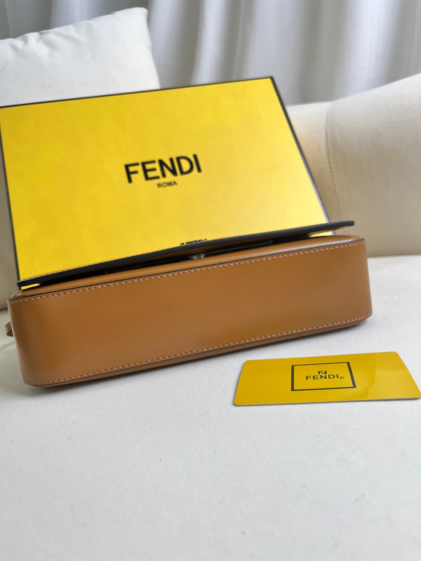 First Sight clutch in smooth calfskin with large F metal hardware and chain