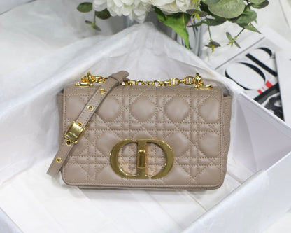 new Edision arrival. The Dior Caro bag is crafted in apricot calfskin and embellished with the signature cannage stitching.