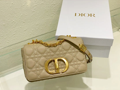 new Edision arrival. The Dior Caro bag is crafted in apricot calfskin and embellished with the signature cannage stitching.