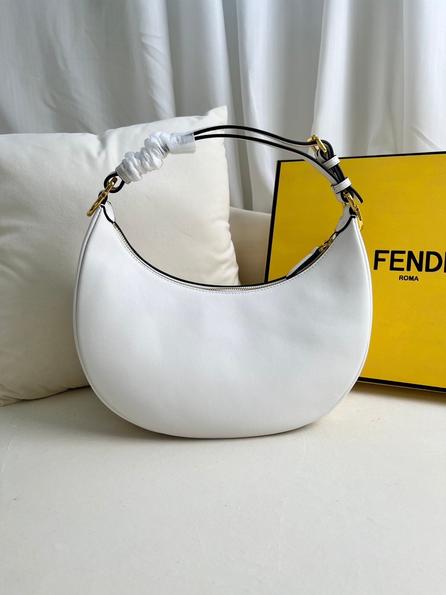 FEND1praphy underarm bag featuring a crescent shape