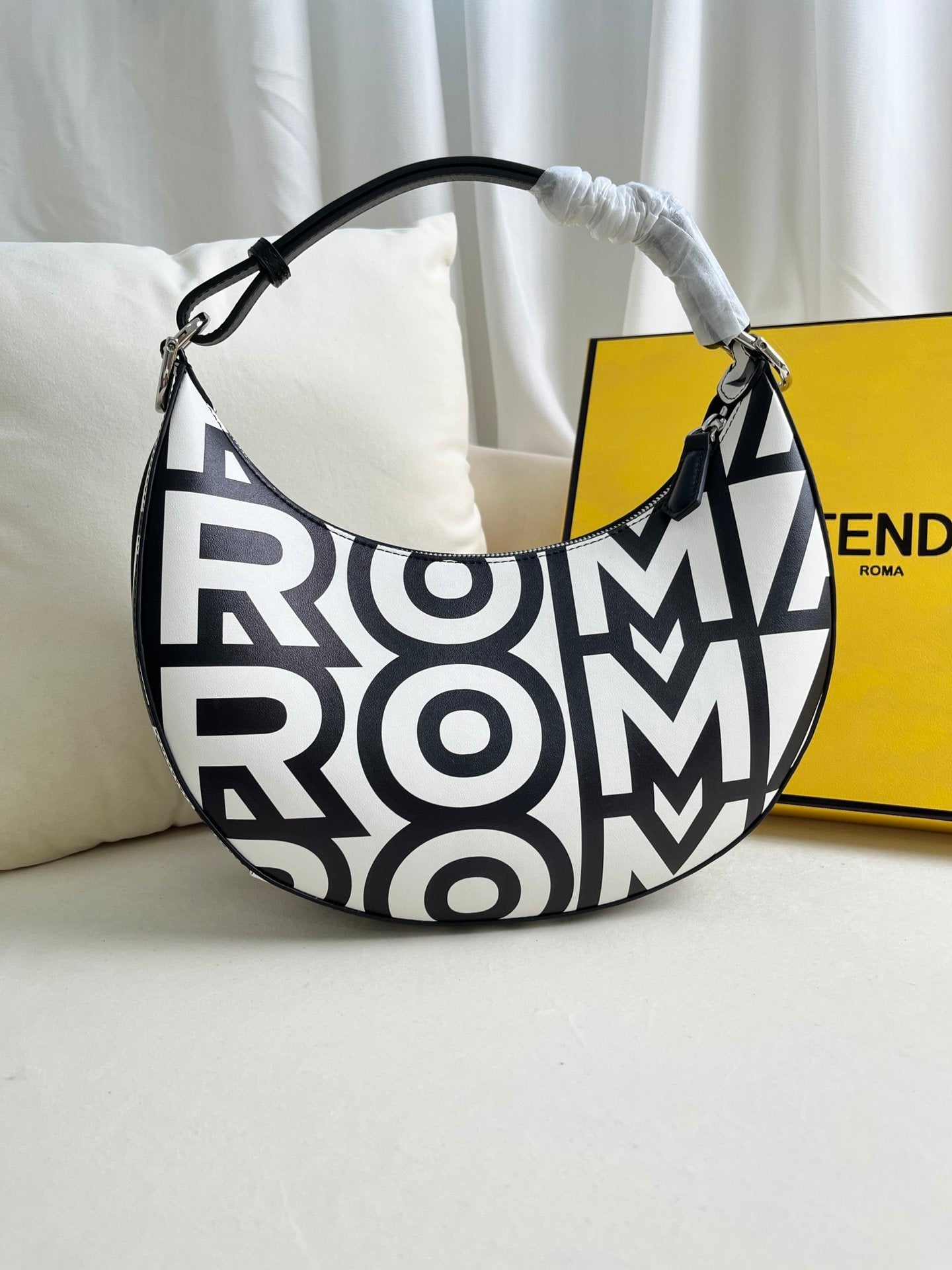 FEND1praphy underarm bag featuring a crescent shape