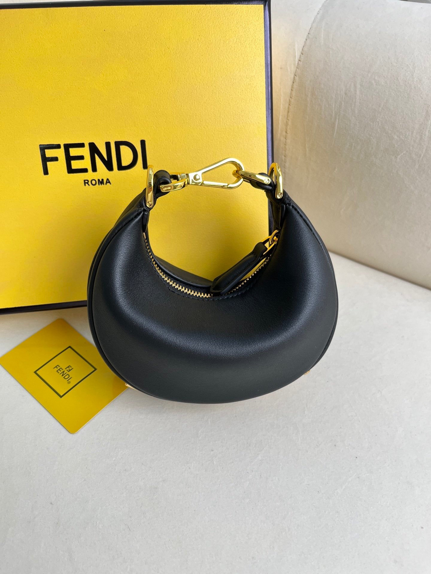 FEND1praphy underarm bag featuring a crescent shape
