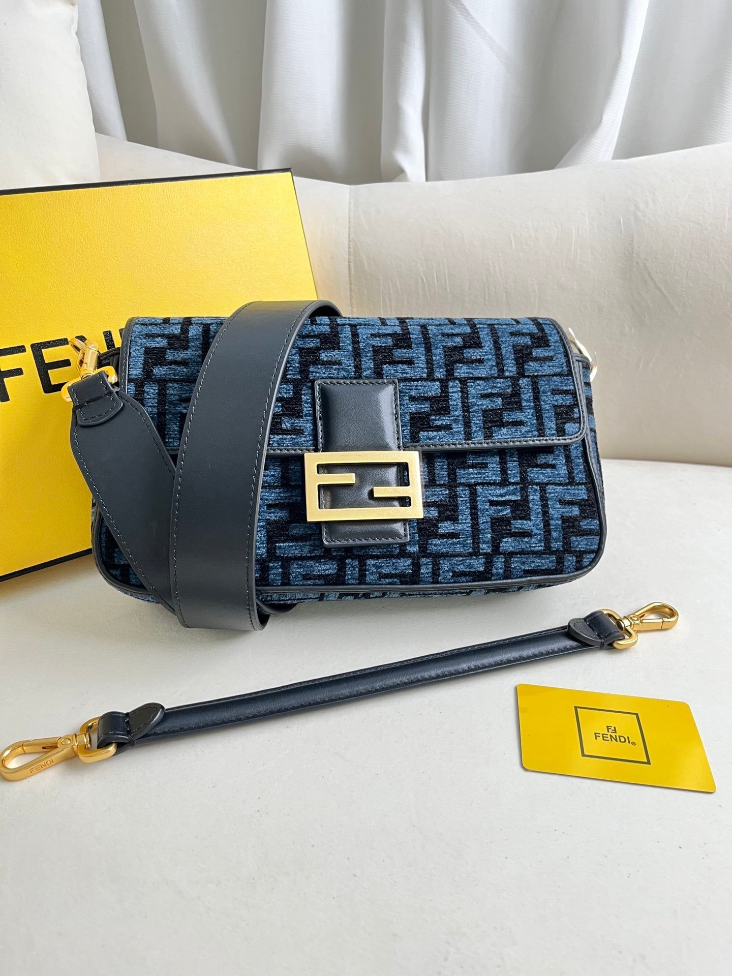 Baguette bag in dark gray FF brocade fabric More Details Iconic Baguette medium bag in chenille with dark gray FF brocade motif.