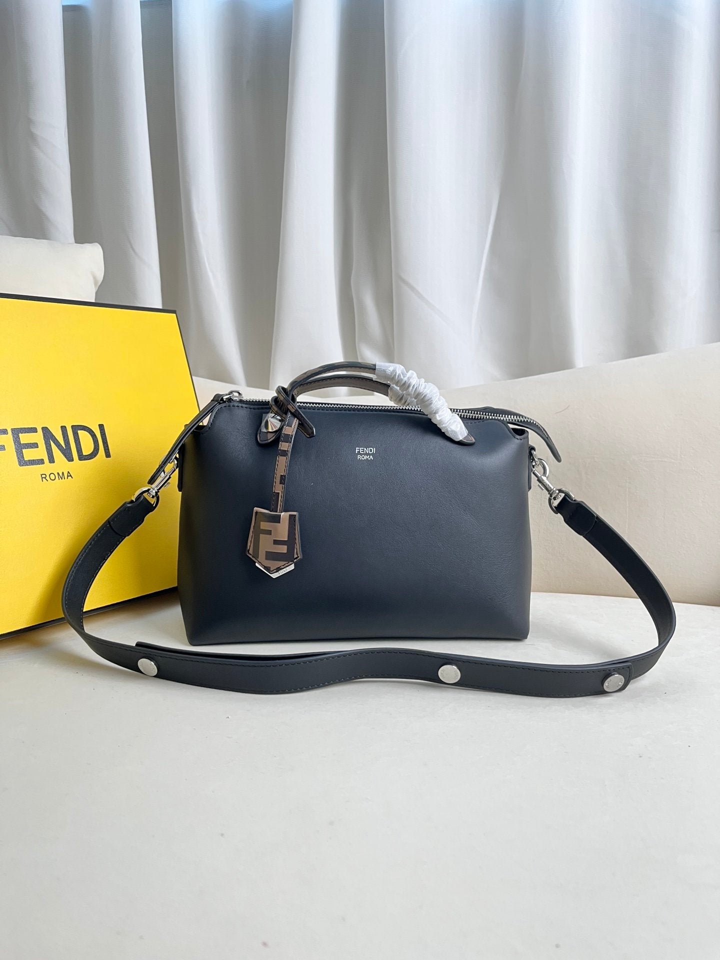 BY THE WAY zipped Boston tote bag with double handles and embellished with a plaque.