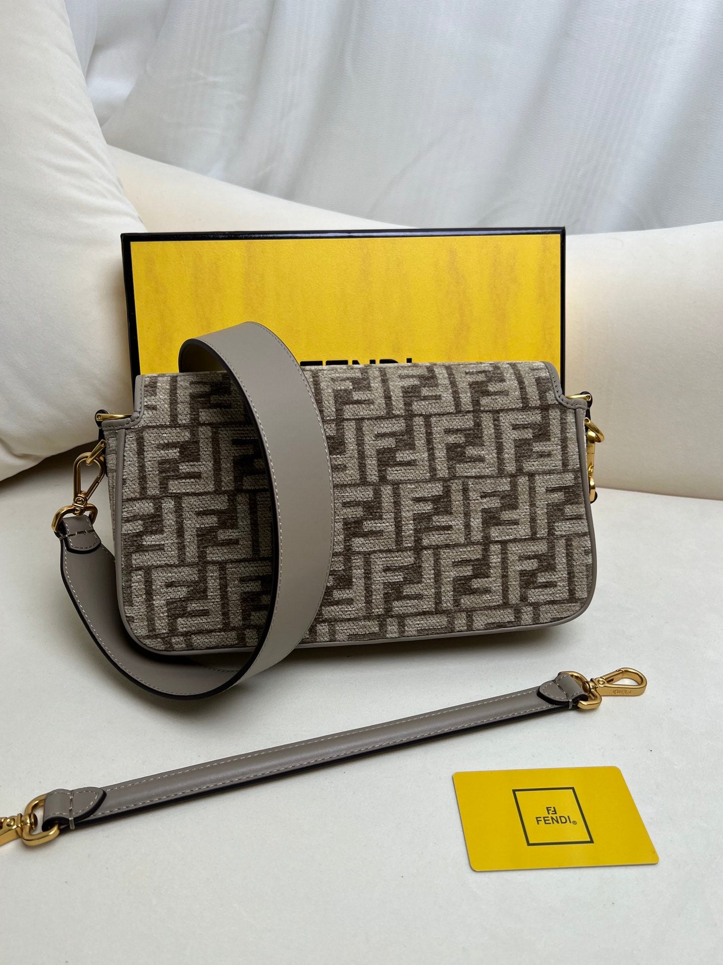Baguette bag in dark gray FF brocade fabric More Details Iconic Baguette medium bag in chenille with dark gray FF brocade motif.