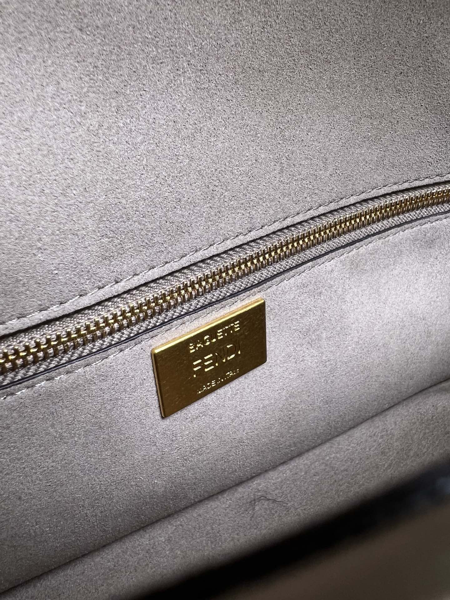 Baguette bag in dark gray FF brocade fabric More Details Iconic Baguette medium bag in chenille with dark gray FF brocade motif.