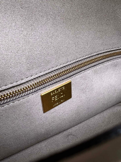 Baguette bag in dark gray FF brocade fabric More Details Iconic Baguette medium bag in chenille with dark gray FF brocade motif.