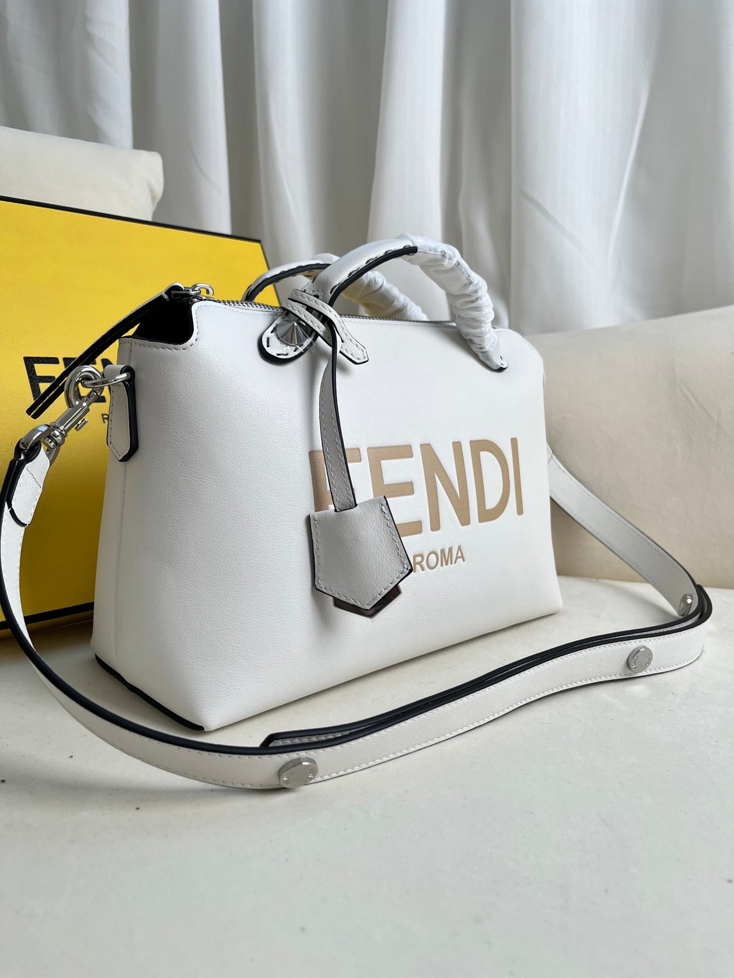 BY THE WAY zipped Boston tote bag with double handles and embellished with a plaque.