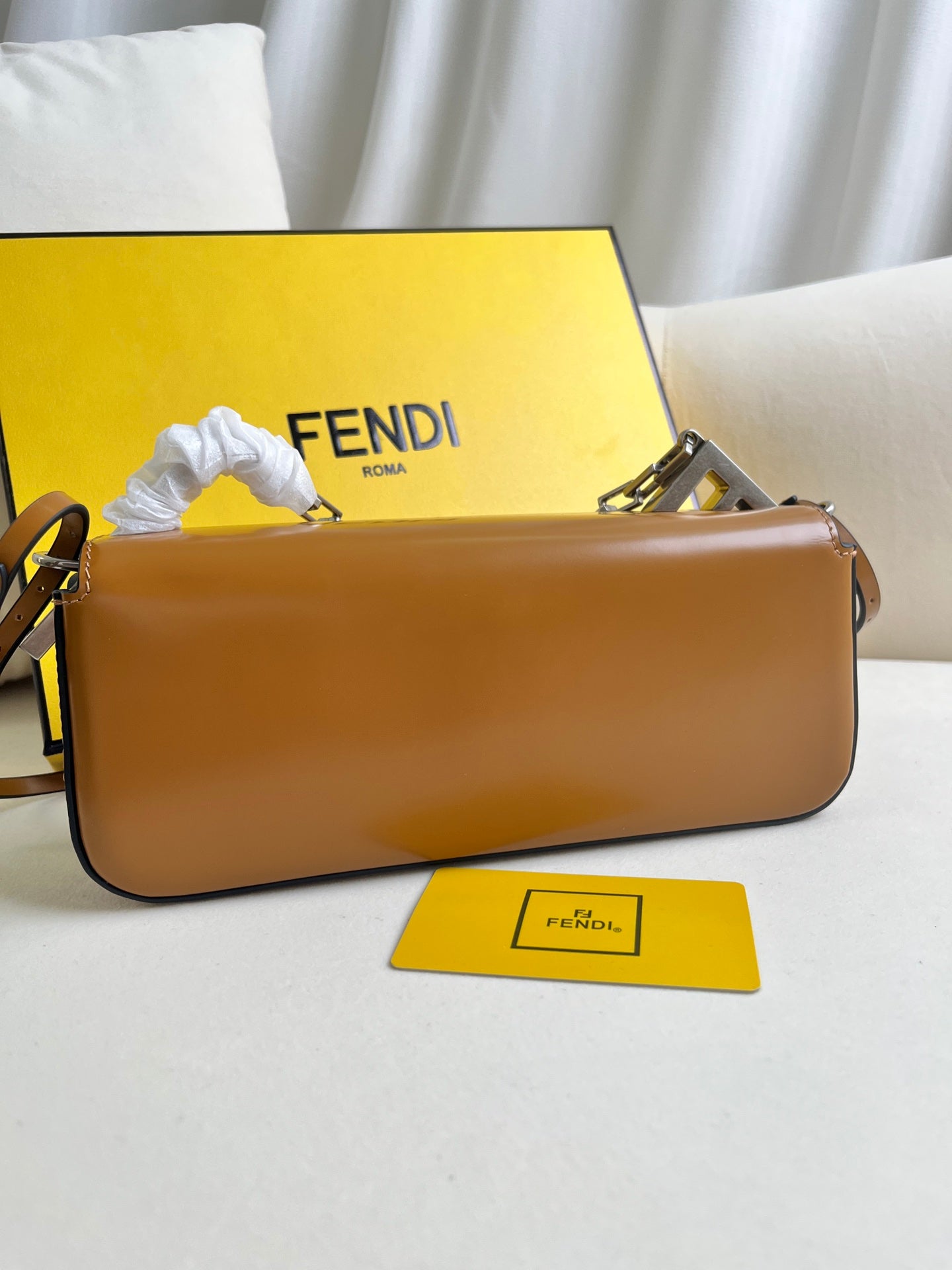 First Sight clutch in smooth calfskin with large F metal hardware and chain