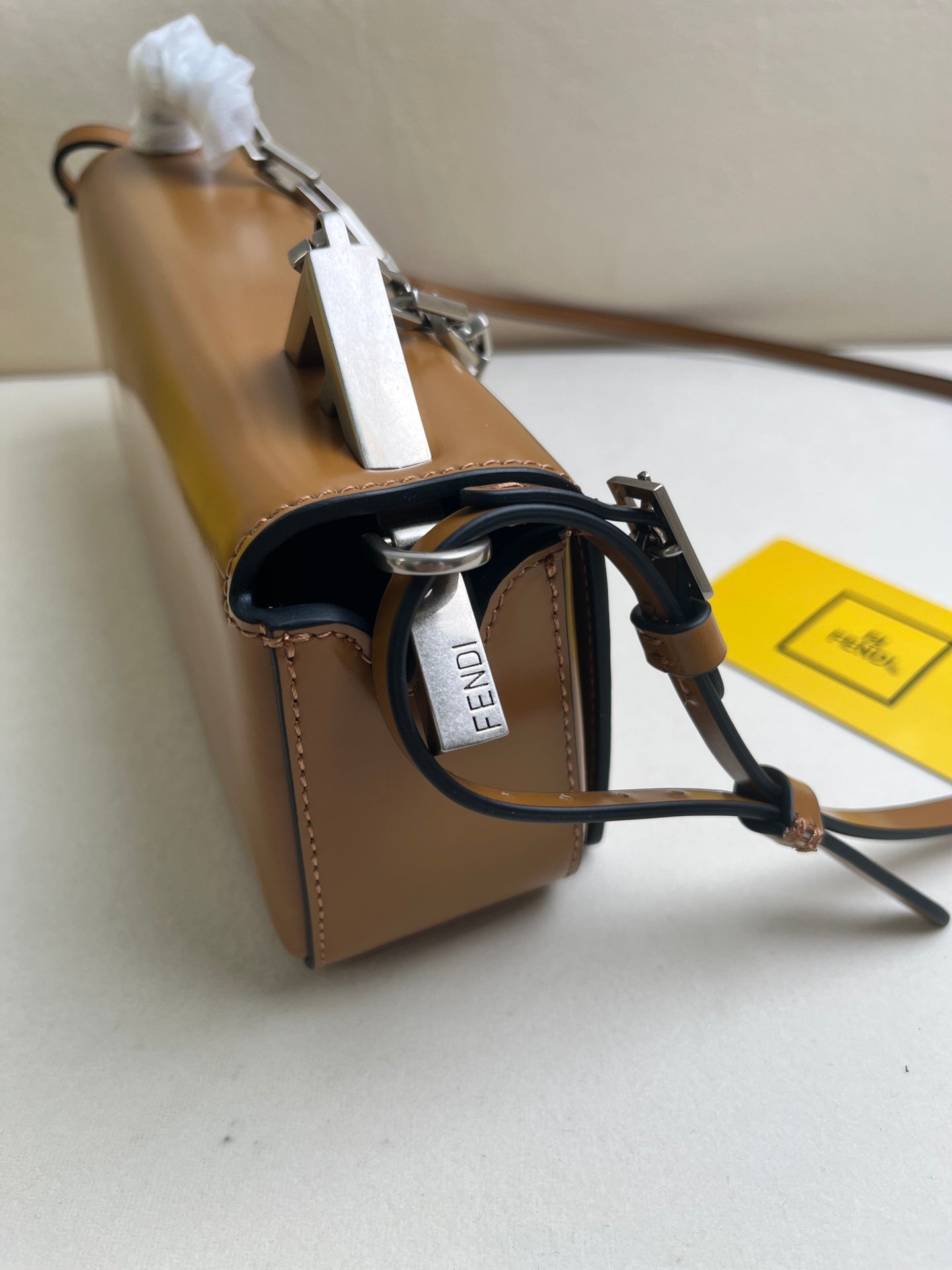 First Sight clutch in smooth calfskin with large F metal hardware and chain