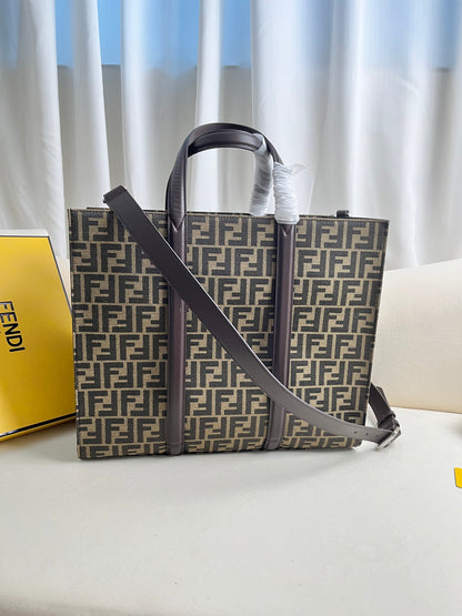 FENDI spacious tote bag in recycled jacquard fabric featuring gray and black FF motif. Featuring fabric-lined interior compartments, interior zip pocket and silver-tone hardware.