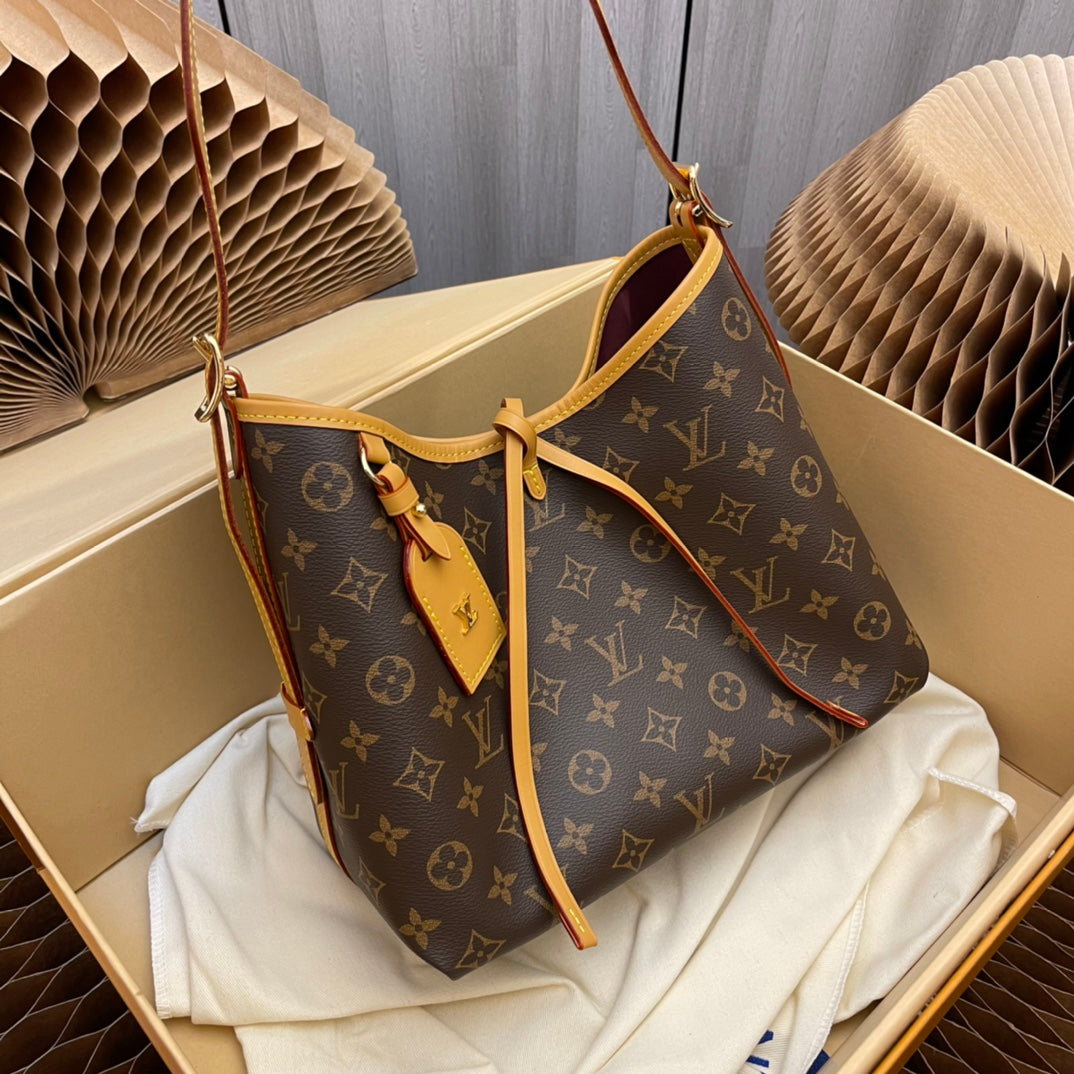 Model number M46203 CarryAll small handbag made of Monogram canvas and leather trim