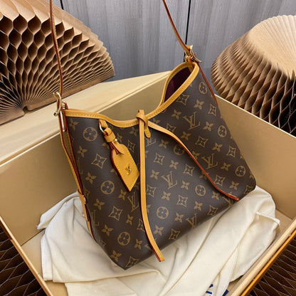 Model number M46203 CarryAll small handbag made of Monogram canvas and leather trim