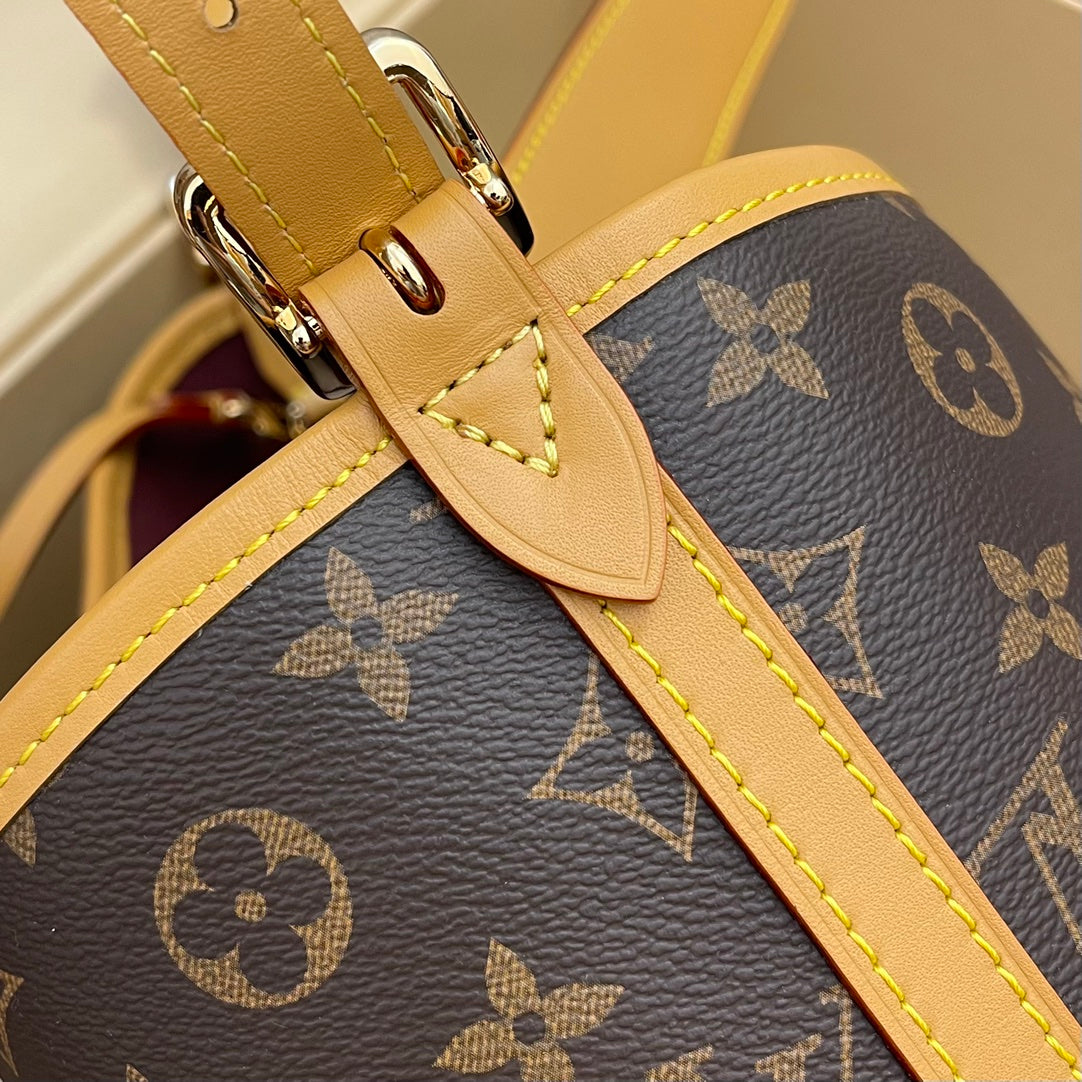 Model number M46203 CarryAll small handbag made of Monogram canvas and leather trim