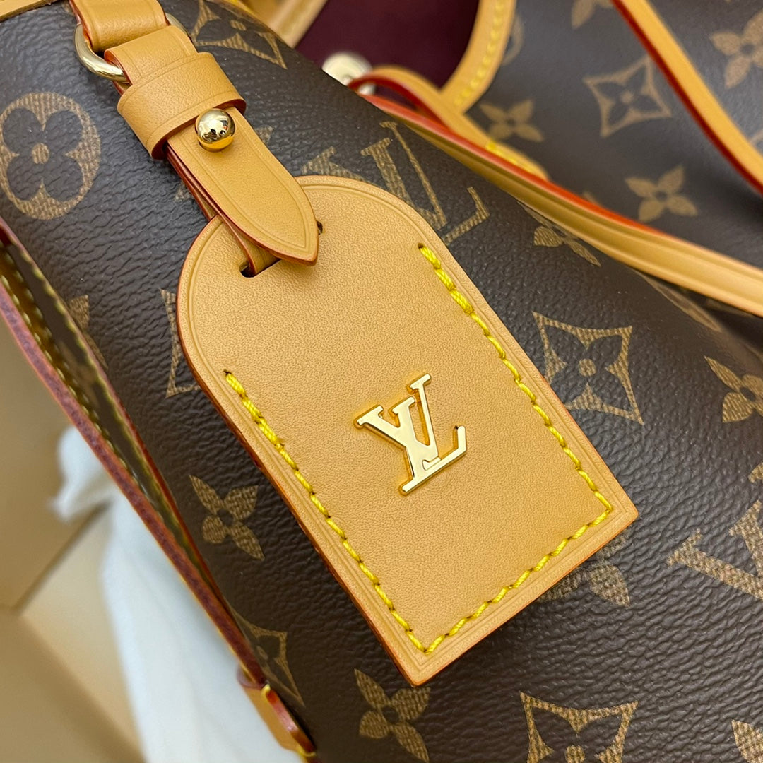 Model number M46203 CarryAll small handbag made of Monogram canvas and leather trim