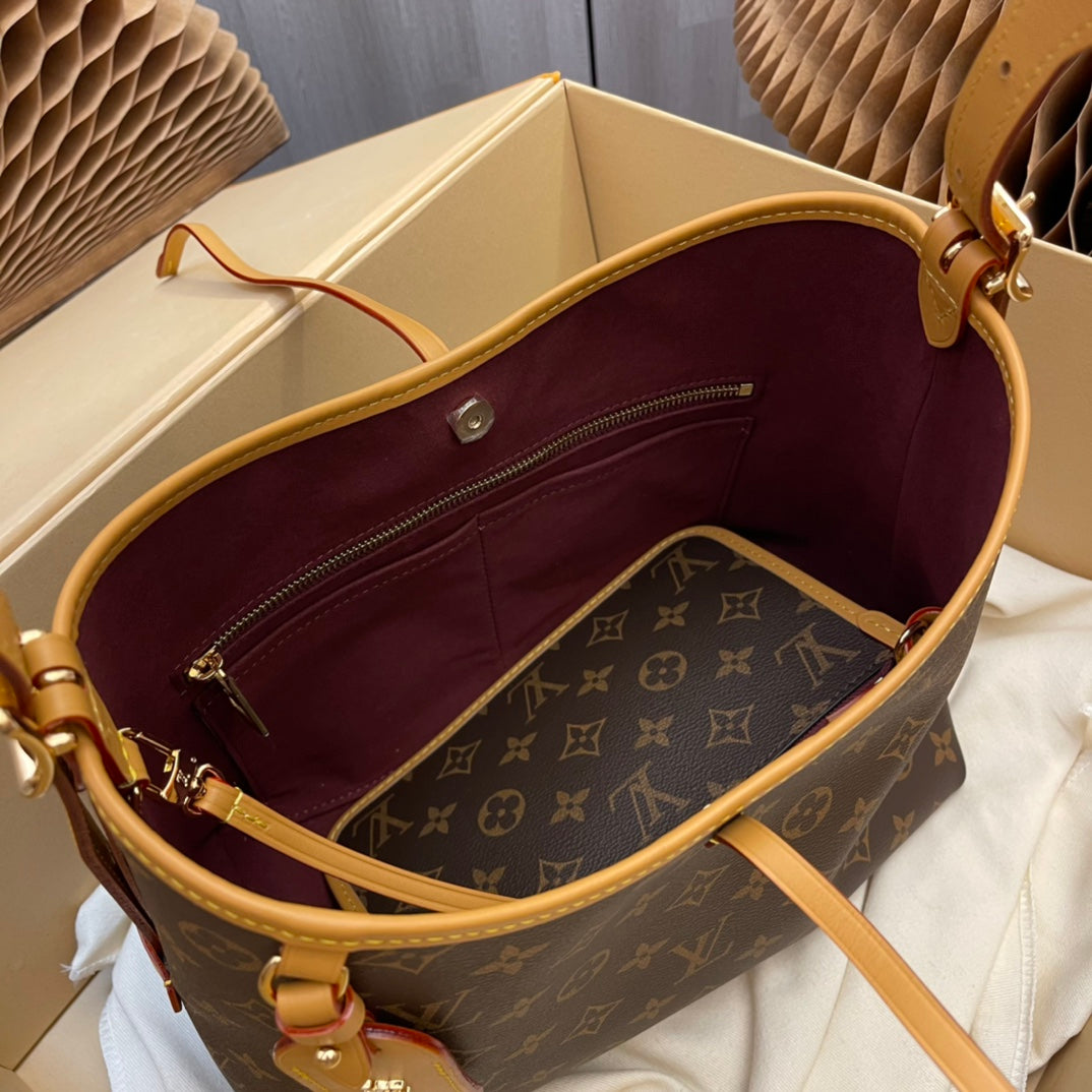 Model number M46203 CarryAll small handbag made of Monogram canvas and leather trim